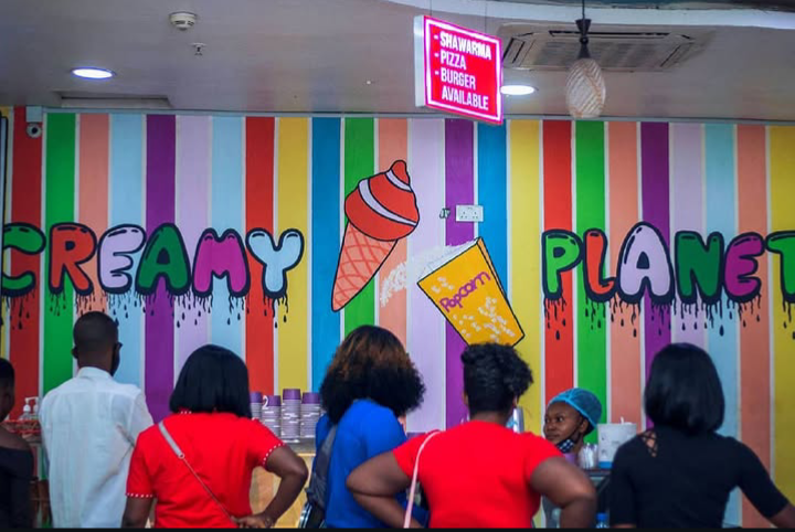 Colourful striped Creamy Planet mural wall with ice cream cone and popcorn artwork